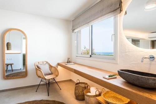 a bathroom with a large sink and a window at Villa Atalis in Menorca