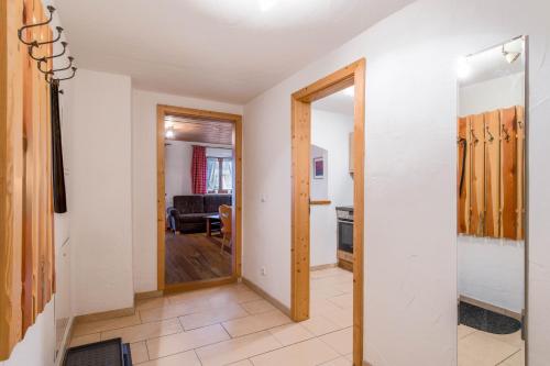 a hallway with a door leading to a living room at Ferienwohnung Daniel in Grainau