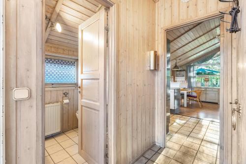an open door to a kitchen with a table at Möwe in Twielenfleth