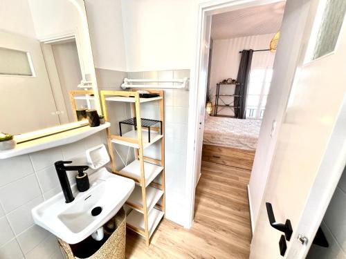 a bathroom with a sink and a mirror at aeolian blu 5 in Parikia