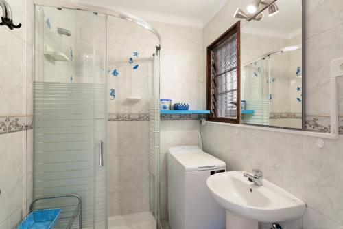 a bathroom with a shower and a sink and a toilet at vv Luca vista mar in Puerto Rico de Gran Canaria