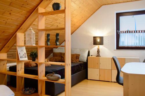 a room with a bunk bed in a loft at Wohnung Karin in Spalt