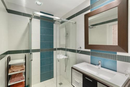 a bathroom with a shower and a sink and a mirror at Casa Santana in Vecindario