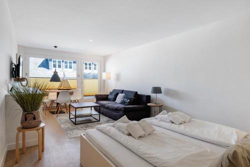 a living room with two beds and a couch at Wohnung Früger in Westerland