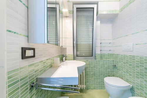 a bathroom with a sink and a toilet at Dimora lungomare terra d'otranto in Otranto