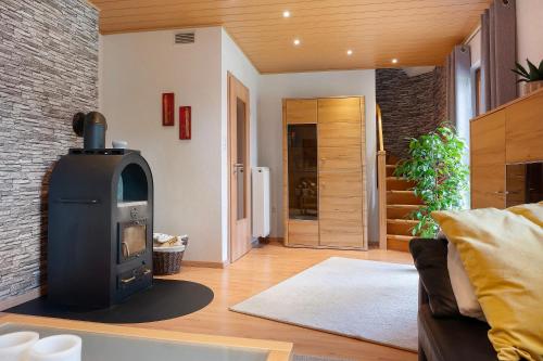 a living room with a wood stove in it at Ferienhaus Thomas in Colnrade