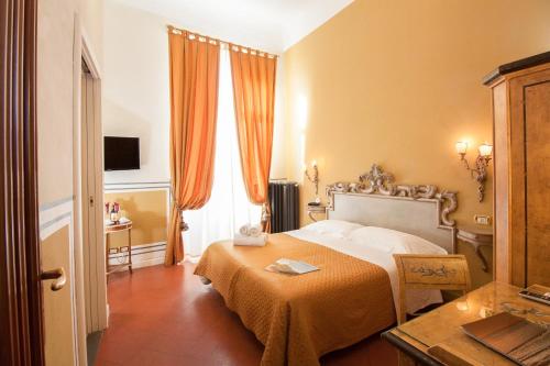 Een bed of bedden in een kamer bij Residenza Vespucci