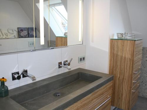 a bathroom with a sink and a mirror at Haus Talblick Sasbachwalden in Sasbachwalden