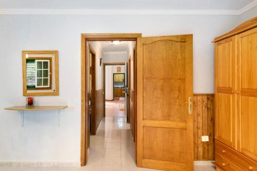 a hallway with a wooden door and a hallway with a hallway at Finca Candelario sc de La Palma in Santa Cruz de la Palma