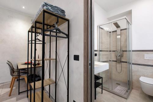 a bathroom with a shower and a toilet and a sink at Double room - Myaostaproject in Aosta