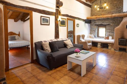 a living room with a couch and a table at Pagorriaga in Beasain