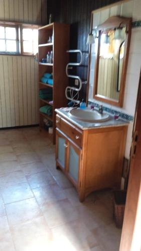 a bathroom with a sink and a mirror at Chalet Rural Marian in Santa Maria de Guia de Gran Canaria