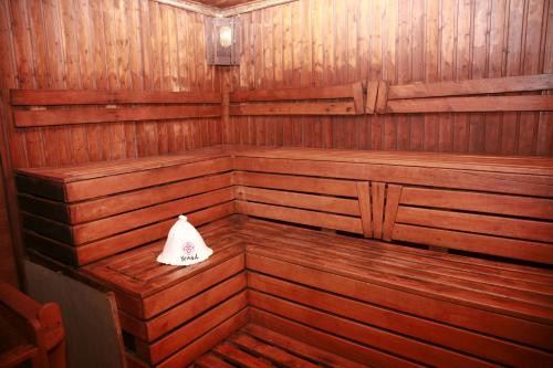 a wooden sauna with a napkin sitting in it at Sava Dream in Zhytomyr