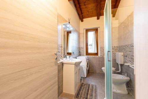 a bathroom with a sink and a toilet at Chalet La Greta Vista Superiore in Firenzuola