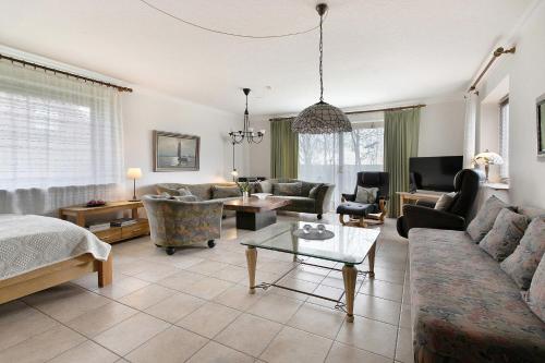 a living room with a couch and a table at Haus Halligblick in Dagebüll