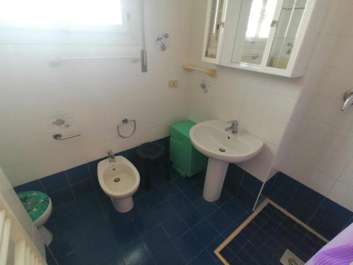 a bathroom with a sink and a toilet at Euroholiday Village 1G in Lido di Jesolo
