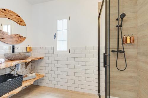 a bathroom with a shower and a sink at La Villa in Tarajalejo