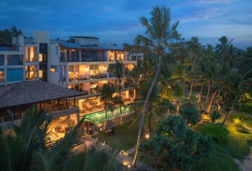 an aerial view of a resort at night at The Rockwall Boutique Hotel Bentota in Bentota