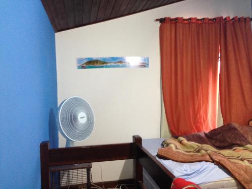 מיטה או מיטות בחדר ב-Praia das Dunas Residence Club