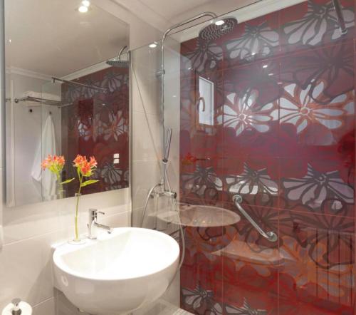 a bathroom with a shower and a white sink at Con Encanto in Port de Soller