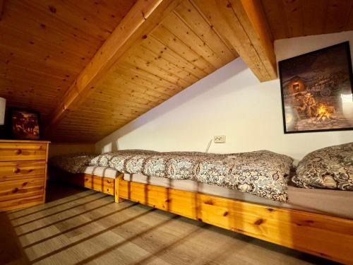 a bedroom with two beds in a attic at Tiny Rooster Lodge in Alt Duvenstedt
