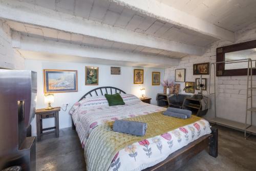 a bedroom with a large bed in a room at La Fabriqueta Apartament Loft in Ríudecañas