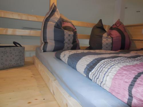 two beds with pillows on them in a room at Ferienhaus am Rheinpark in Kamp-Bornhofen