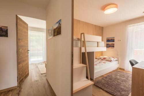 a small bedroom with a bed and a mirror at Apartment Roderer in Völs am Schlern
