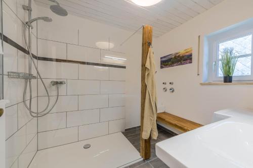 a bathroom with a shower and a sink at Ferienwohnung Parzinger 2 in Chieming