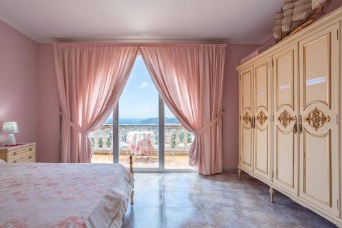 a bedroom with a bed and a large window at Tresa in Lloret de Mar