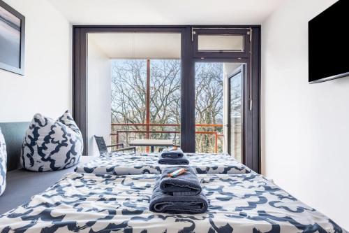 a bedroom with two beds with towels on them at Al Mare in Wunstorf