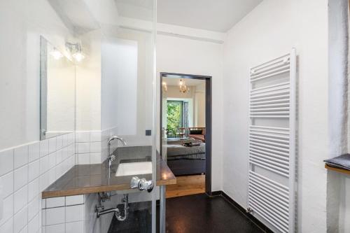 a bathroom with a sink and a mirror at Fewo Boho in der Altstadt in Pirna