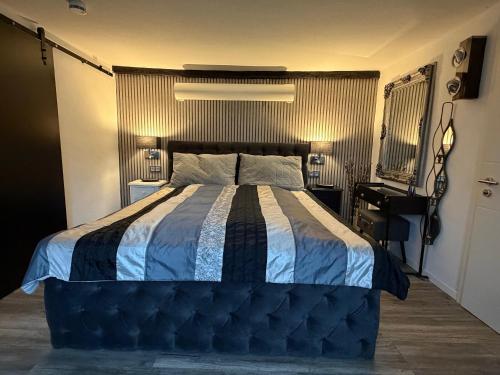 a bedroom with a bed and a desk in it at Kalles Tochter in Melsungen
