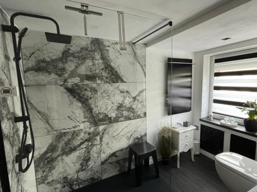 a bathroom with a shower and a sink at Kalles Tochter in Melsungen
