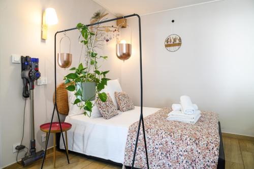 a room with a bed with a mirror at Chez Flo - clim parking - clg in Saint-Pierre-dʼAlbigny