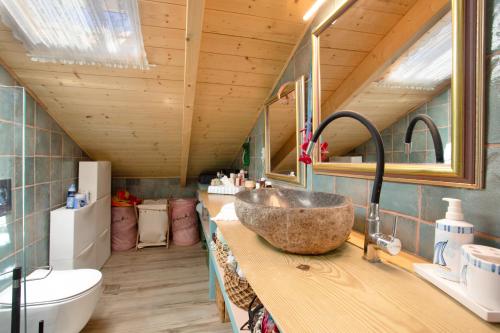 a bathroom with a sink and a toilet in a room at Zante Villa Amici Loft in Zakynthos