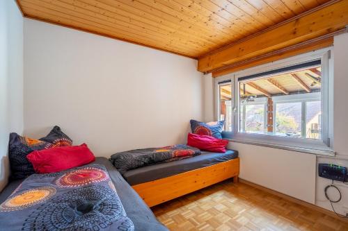 a small room with a bed and a window at Ferienwohnung Agnes in Rheinfelden