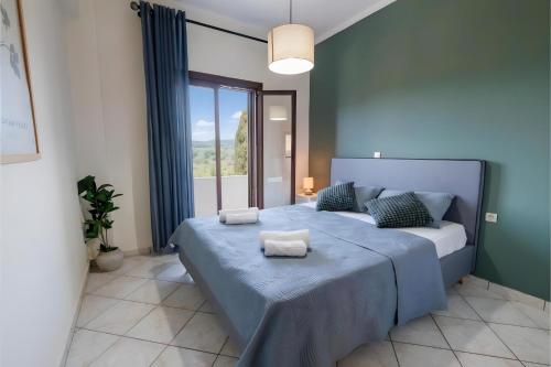 a bedroom with a bed with two towels on it at Breathing Apartments in Virós