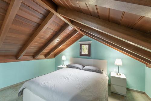 a bedroom with a large bed with wooden ceilings at Casa Efrén in Garafía