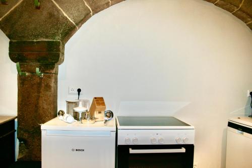 a kitchen with a stove and a stove top oven at Villa Buselmeier in Neuried