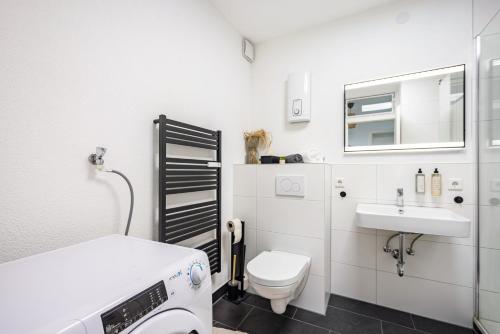a hospital room with a toilet and a sink at Fewo Sonnenaufgang, Ausblick in Augsburg