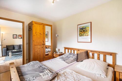 a bedroom with a bed in a room at Bungalow 73 in Zadelsdorf
