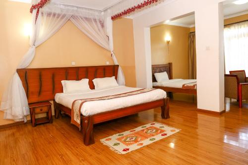 a bedroom with two beds in a room at Fairways Hotel in Narok