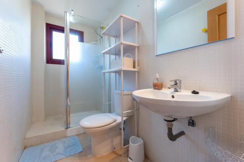 a bathroom with a sink and a toilet and a shower at 212 La Cala azul in La Cala de Mijas