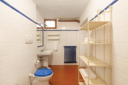 a bathroom with a toilet and a sink at Il Tuo Posto A Greve In Chianti in Greve in Chianti