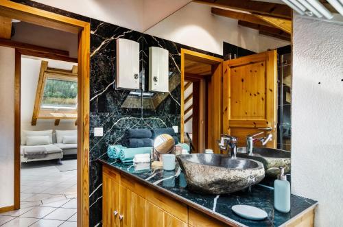 a bathroom with a sink and a counter at Enjoy mal - Apartments in Stockach