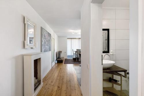 a hallway with a fireplace and a sink in a bathroom at Balingen Apartment in Balingen