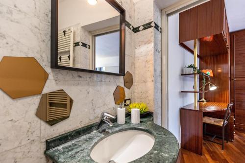 a bathroom with a sink and a mirror at la vigna del Vescovo in Verona