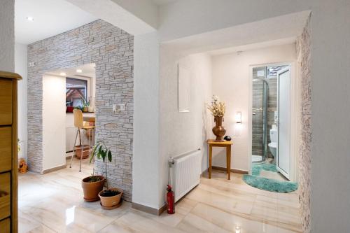a living room with a brick wall at Haus Schliengen in Schliengen