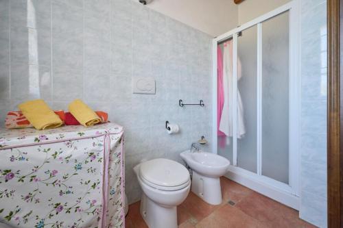 a bathroom with a toilet and a sink at Podere Chinco - Gavorrano in Gavorrano